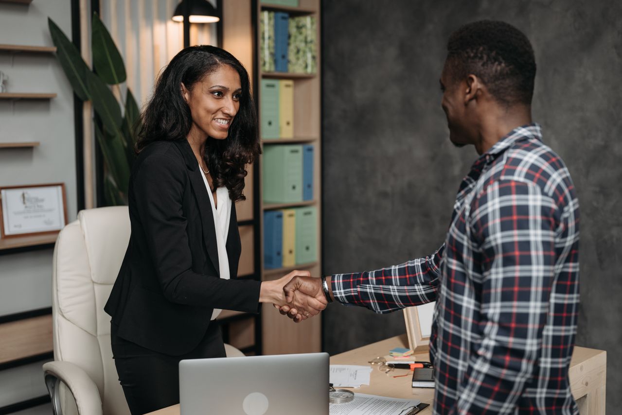 A hiring manager welcoming a new employee